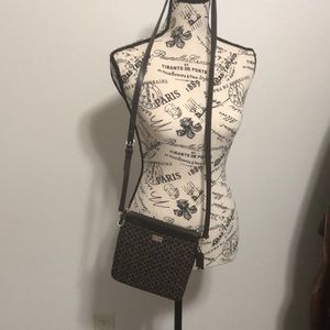 COACH crossbody in brown and tan colors,
